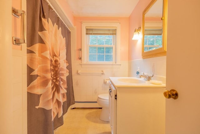 22 Liberty St, Bellingham, MA 02019 - full bathroom featuring baseboard heating, plenty of natural light, vanity, wainscoting, and tile walls