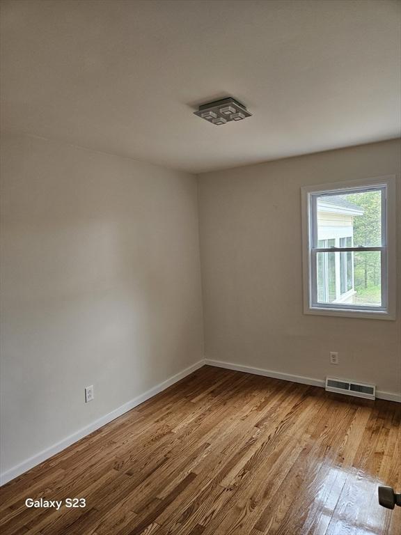 461 N Orange Rd, Athol, MA 01331 - empty room with wood finished floors and baseboards