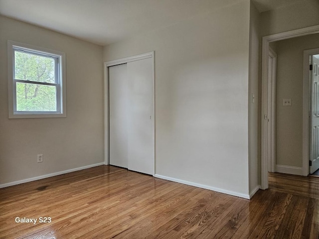 461 N Orange Rd, Athol, MA 01331 - unfurnished bedroom with wood finished floors and a closet