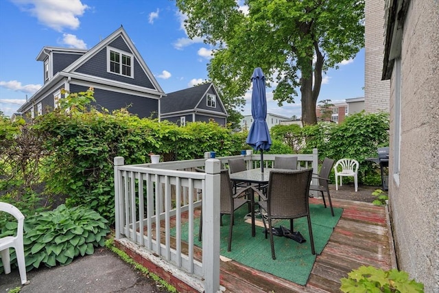 439 Walnut Ave, Boston, MA 02119 - wooden deck featuring outdoor dining space