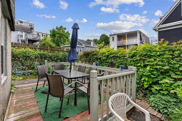 439 Walnut Ave, Boston, MA 02119 - wooden terrace with outdoor dining area