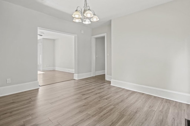 10 Jackson St, Ayer, MA 01432 - unfurnished room with a chandelier, wood finished floors, and baseboards