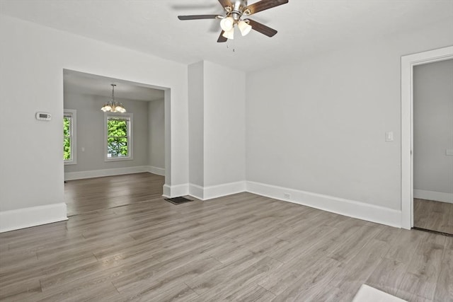 10 Jackson St, Ayer, MA 01432 - spare room with a chandelier, ceiling fan, wood finished floors, and baseboards