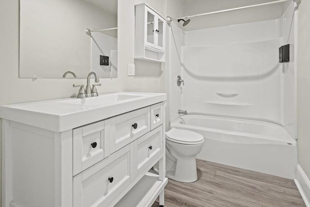 10 Jackson St, Ayer, MA 01432 - full bathroom with wood finished floors, bathing tub / shower combination, toilet, and vanity