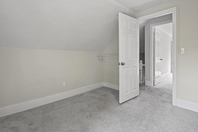 10 Jackson St, Ayer, MA 01432 - bonus room with carpet floors, lofted ceiling, and baseboards