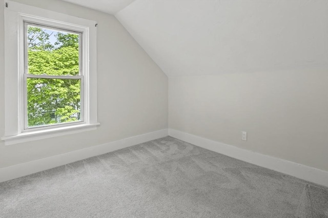 10 Jackson St, Ayer, MA 01432 - bonus room with carpet floors, lofted ceiling, and baseboards
