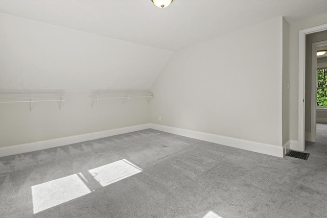 10 Jackson St, Ayer, MA 01432 - additional living space featuring carpet flooring, baseboards, and lofted ceiling