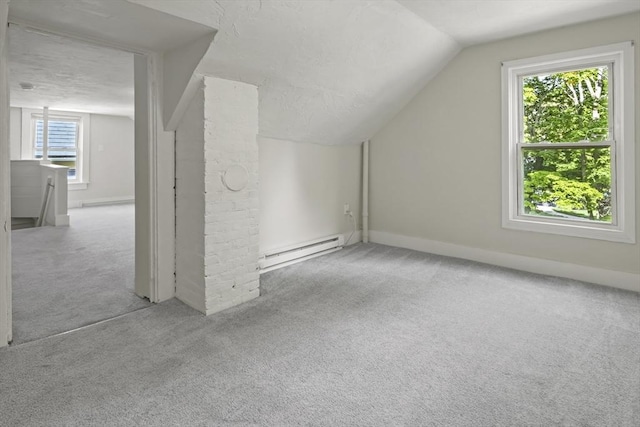 10 Jackson St, Ayer, MA 01432 - bonus room with a baseboard heating unit, carpet, lofted ceiling, and baseboards