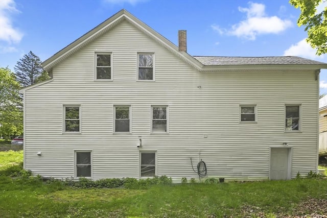 10 Jackson St, Ayer, MA 01432 - view of side of property featuring a chimney