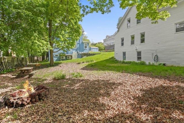 10 Jackson St, Ayer, MA 01432 - view of yard featuring a fire pit and fence