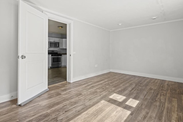 10 Jackson St, Ayer, MA 01432 - unfurnished room with wood finished floors, ornamental molding, and baseboards