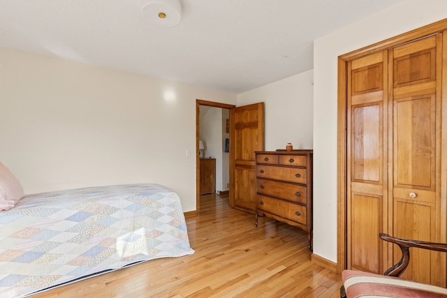 bedroom with light wood-type flooring