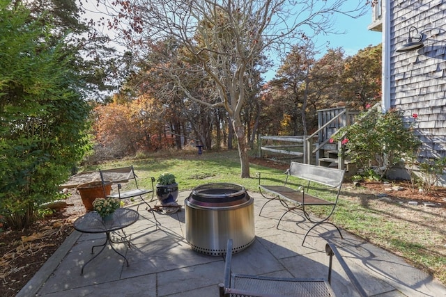 view of patio / terrace featuring an outdoor fire pit