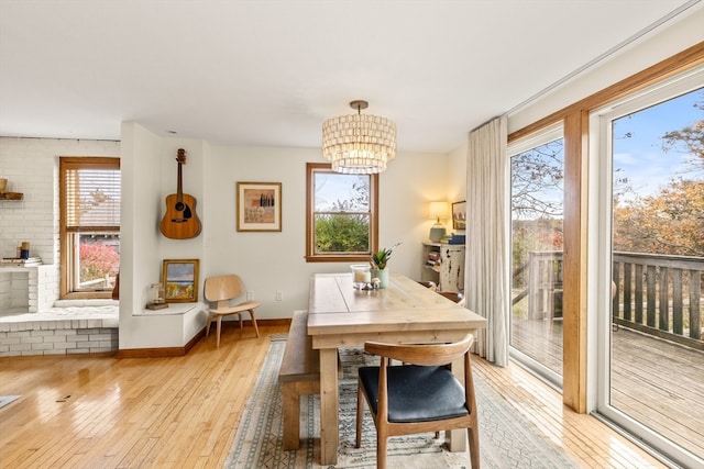 dining room featuring light hardwood / wood-style floors and an inviting chandelier