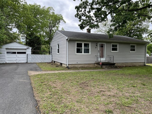 50 Feltham Rd, Springfield, MA 01118 - view of front of home with a garage, an outdoor structure, a chimney, and asphalt driveway