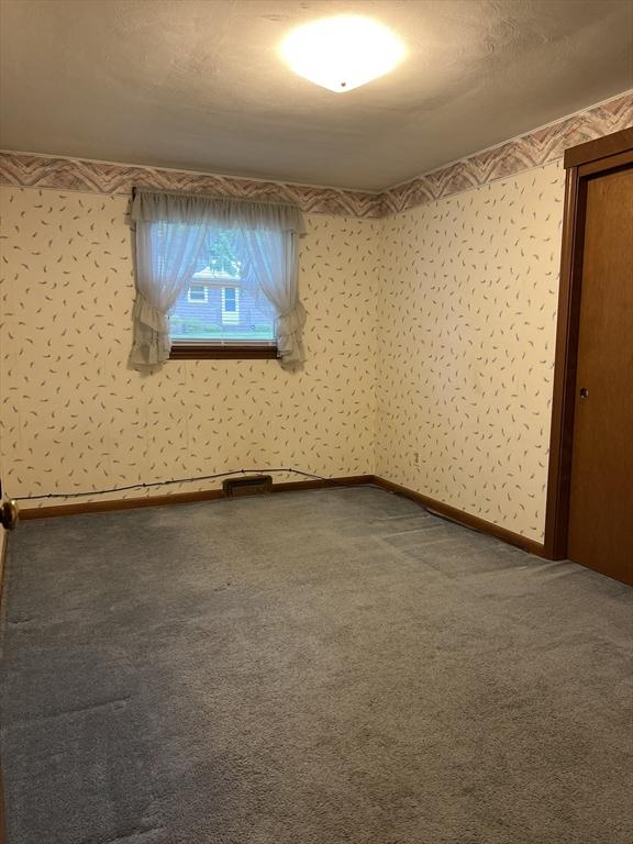 50 Feltham Rd, Springfield, MA 01118 - carpeted empty room featuring baseboards
