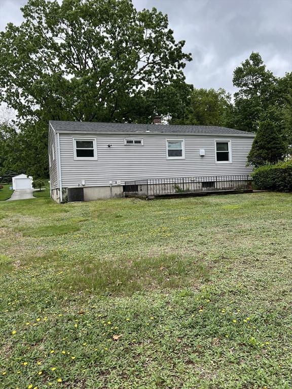 50 Feltham Rd, Springfield, MA 01118 - back of property featuring a yard, central AC, and a deck
