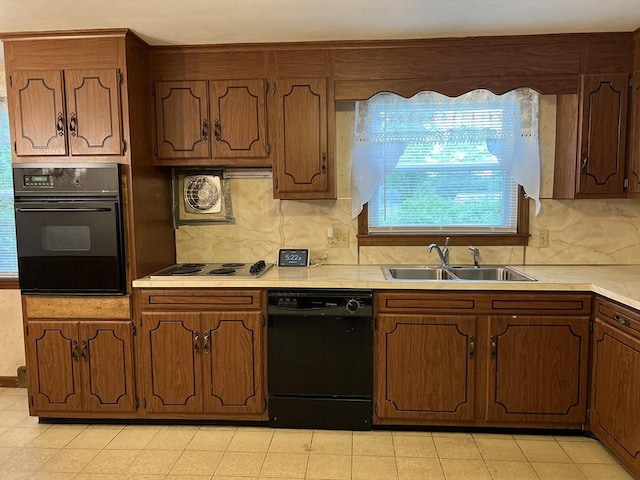 50 Feltham Rd, Springfield, MA 01118 - kitchen featuring black appliances, a sink, light countertops, and tasteful backsplash