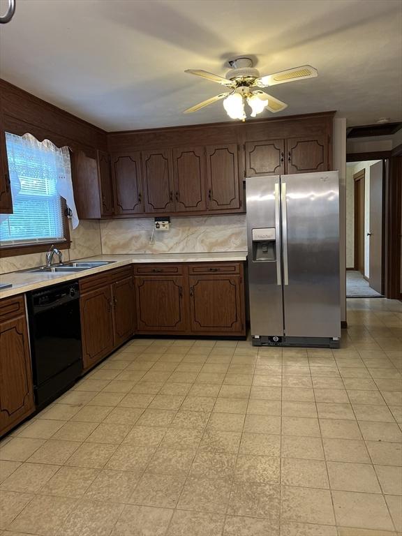 50 Feltham Rd, Springfield, MA 01118 - kitchen with stainless steel refrigerator with ice dispenser, black dishwasher, light countertops, a sink, and ceiling fan