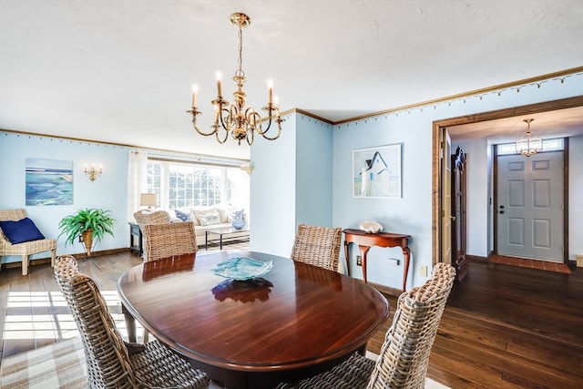 dining room with crown molding and dark hardwood / wood-style flooring