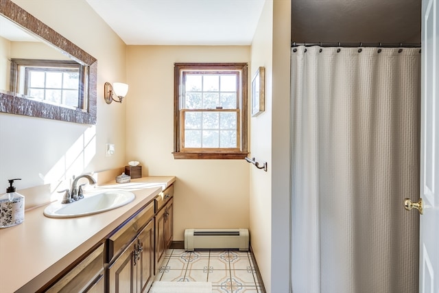 bathroom with vanity and a baseboard radiator