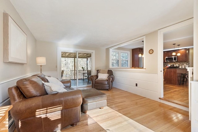 16 Kirsi Cir, Westford, MA 01886 - living room with light wood finished floors and wainscoting