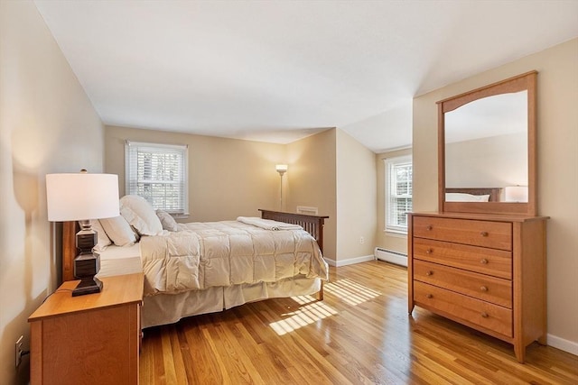 16 Kirsi Cir, Westford, MA 01886 - bedroom featuring baseboard heating, light wood finished floors, multiple windows, and baseboards