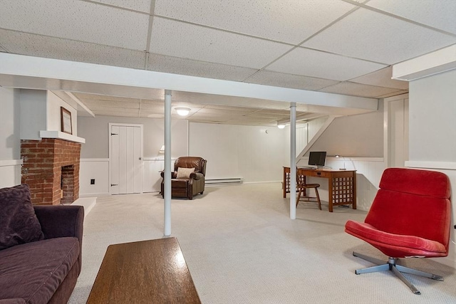 16 Kirsi Cir, Westford, MA 01886 - finished basement with baseboard heating, a paneled ceiling, carpet flooring, wainscoting, and a fireplace