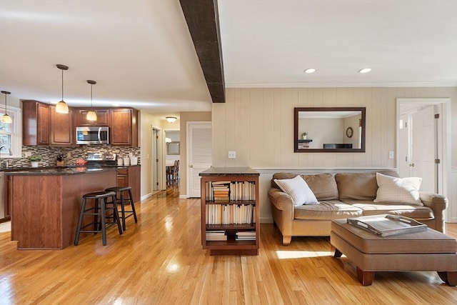 16 Kirsi Cir, Westford, MA 01886 - living room with light wood-style flooring, ornamental molding, and recessed lighting