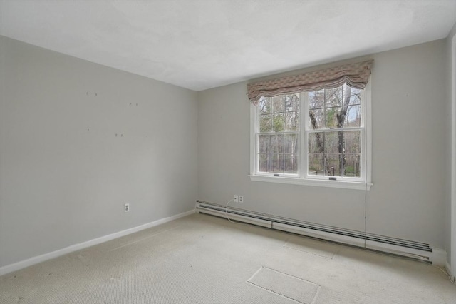 empty room featuring carpet, baseboards, and baseboard heating
