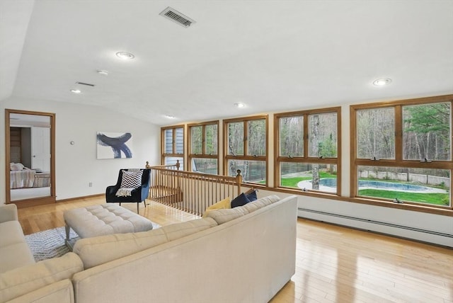 living area featuring visible vents, lofted ceiling, recessed lighting, a baseboard radiator, and light wood finished floors