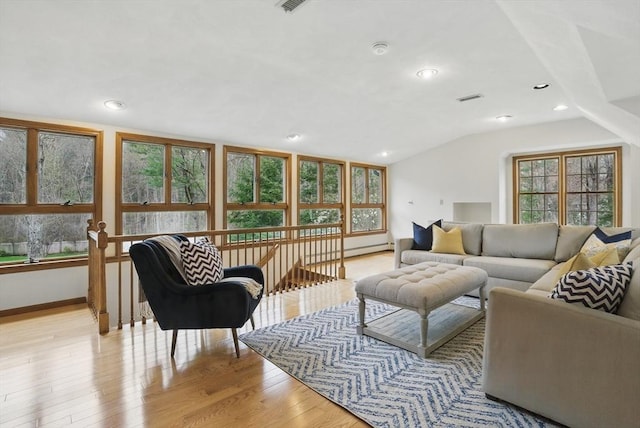 living room with baseboards, recessed lighting, light wood-style flooring, and lofted ceiling