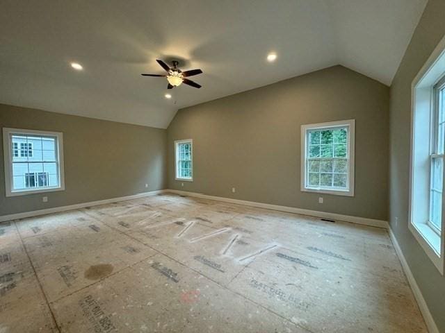 empty room with vaulted ceiling, recessed lighting, a ceiling fan, and baseboards