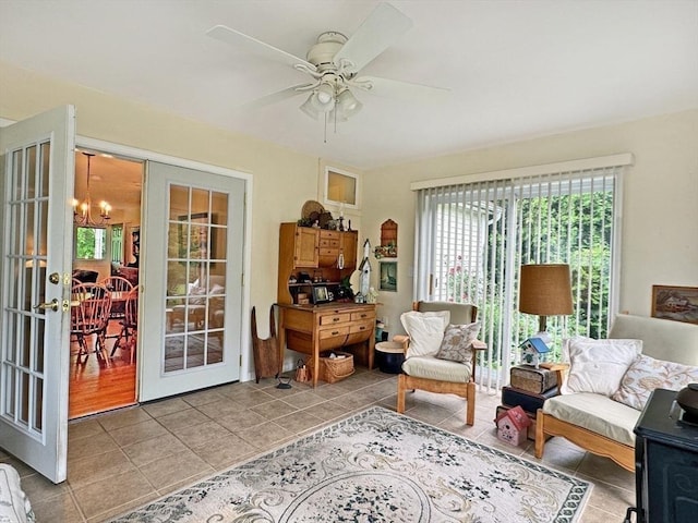 5 Boyle Rd, Gill, MA 01354 - living room featuring french doors, light tile patterned floors, ceiling fan, and a chandelier