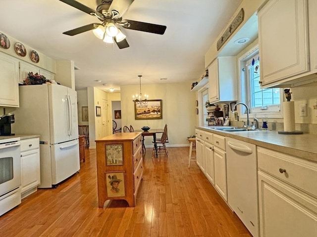 5 Boyle Rd, Gill, MA 01354 - kitchen featuring white appliances, a chandelier, ceiling fan, and light wood-style flooring