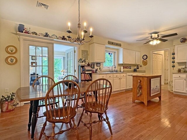5 Boyle Rd, Gill, MA 01354 - dining area featuring hardwood / wood-style flooring, a chandelier, and a ceiling fan