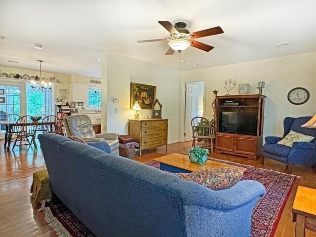 5 Boyle Rd, Gill, MA 01354 - living room featuring a ceiling fan, wood finished floors, and a chandelier