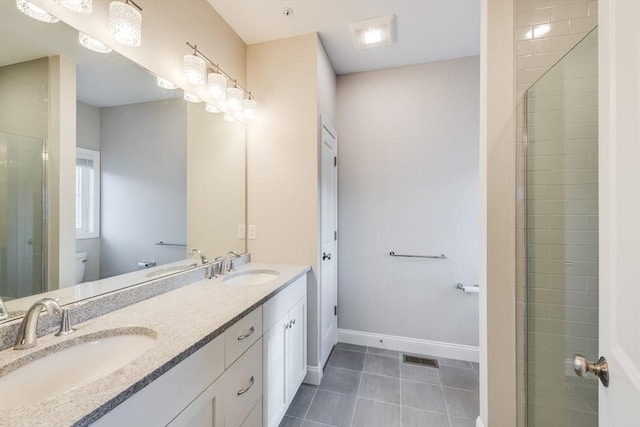 full bath featuring tile patterned floors, toilet, and a sink