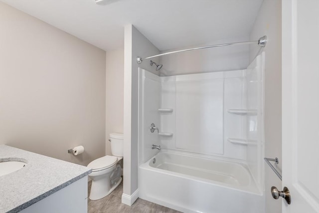 bathroom featuring toilet, vanity, and bathing tub / shower combination