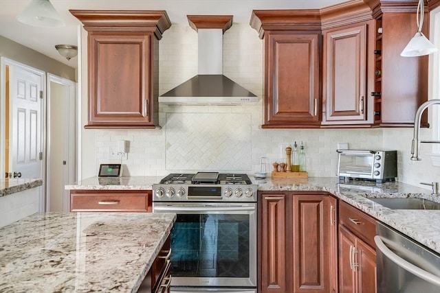 kitchen with decorative backsplash, sink, wall chimney range hood, and stainless steel appliances