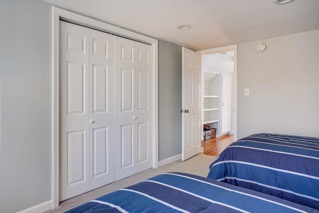 bedroom with carpet floors and a closet