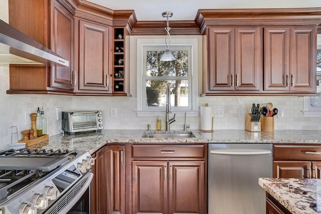 kitchen with backsplash, appliances with stainless steel finishes, wall chimney range hood, and light stone counters