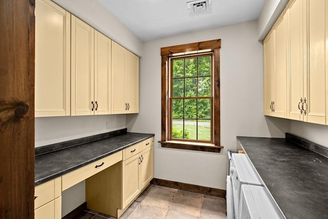 3 Side Hill Rd, Hingham, MA 02043 - kitchen featuring cream cabinets, baseboards, dark countertops, and built in desk