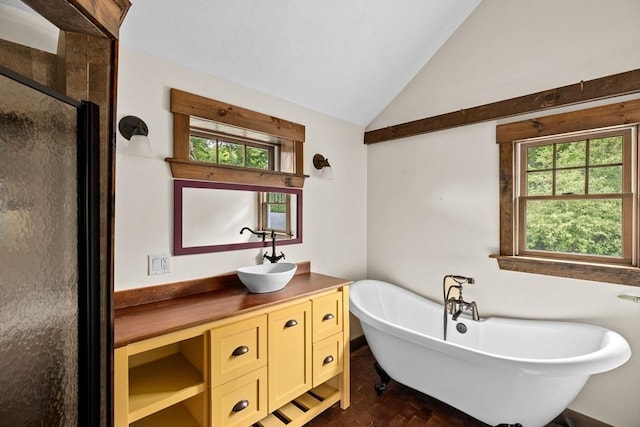 3 Side Hill Rd, Hingham, MA 02043 - bathroom with a stall shower, vanity, plenty of natural light, a freestanding tub, and vaulted ceiling