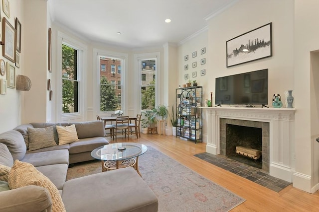 279 Beacon St Unit 1, Boston, MA 02116 - living area with wood finished floors, crown molding, a fireplace, and recessed lighting