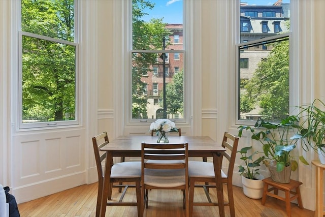 279 Beacon St Unit 1, Boston, MA 02116 - dining area with hardwood / wood-style floors and a decorative wall