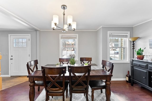 dining room with dark wood-style floors, baseboards, a chandelier, and ornamental molding