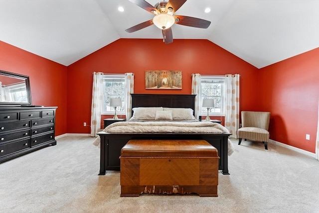 bedroom featuring baseboards, vaulted ceiling, and light colored carpet