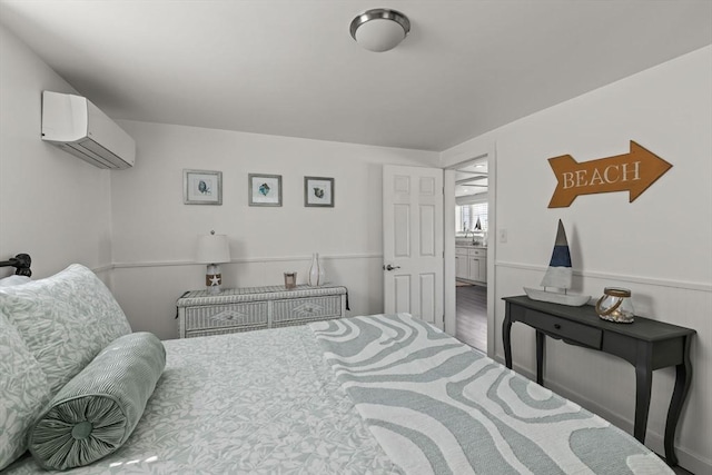 bedroom featuring a wall mounted air conditioner