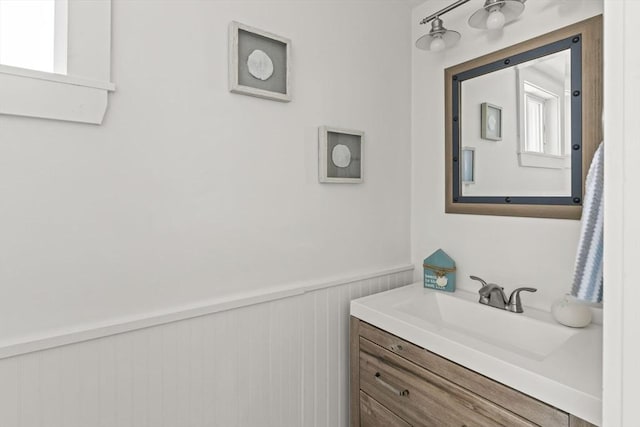 bathroom with wainscoting and vanity